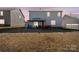 Large backyard with a covered patio, perfect for entertaining at 9142 Mackinaw Dr, Gastonia, NC 28056