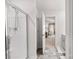 Shower leads to ensuite bathroom featuring gray tile and doorway to the main bedroom at 9142 Mackinaw Dr, Gastonia, NC 28056