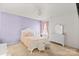 Cozy bedroom with a bed, dresser, neutral carpet and pastel color accent wall at 9142 Mackinaw Dr, Gastonia, NC 28056