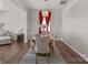 Elegant dining room with chandelier, table set for six and red drapes at 9142 Mackinaw Dr, Gastonia, NC 28056