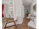 Bright hallway leading to dining room, furnished with chairs and decorative table with vase and picture frame at 9142 Mackinaw Dr, Gastonia, NC 28056