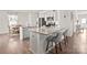 Contemporary kitchen featuring granite countertops, white cabinets, stainless steel appliances, and barstool seating at the island at 9142 Mackinaw Dr, Gastonia, NC 28056