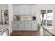 Charming kitchen with gray cabinetry, modern appliances, granite countertops, and butler's pantry with coffee station at 9142 Mackinaw Dr, Gastonia, NC 28056