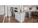 Bright kitchen with stainless steel appliances, granite countertops, kitchen island, and an open layout at 9142 Mackinaw Dr, Gastonia, NC 28056