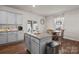 Bright kitchen features grey cabinets, granite countertops, stainless steel appliances and a breakfast nook at 9142 Mackinaw Dr, Gastonia, NC 28056