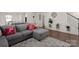 Cozy living room with modern gray sofa, rug, and accent furniture at 9142 Mackinaw Dr, Gastonia, NC 28056