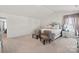 Spacious main bedroom featuring a bed, two chairs, and natural light from the windows at 9142 Mackinaw Dr, Gastonia, NC 28056