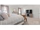 Light-filled main bedroom featuring furniture, media console, and neutral colored carpet at 9142 Mackinaw Dr, Gastonia, NC 28056