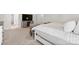 Well-lit main bedroom featuring furniture, TV and doorway to ensuite bathroom at 9142 Mackinaw Dr, Gastonia, NC 28056