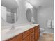 Well-lit bathroom with double sinks, framed mirrors, a shower with glass doors and lots of cabinet storage at 1005 Jody Dr, Matthews, NC 28104