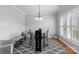 Formal dining area with modern furnishings and abundant natural light through shuttered windows at 1005 Jody Dr, Matthews, NC 28104