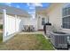 This patio has sparse green grass and includes a table and chairs, and a privacy fence at 1005 Jody Dr, Matthews, NC 28104