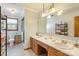 Bright bathroom showcasing a double sink vanity, large mirror, and a separate shower at 101 Griffin St, Stanley, NC 28164