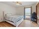 Bright bedroom with hardwood floors, a queen bed, and a cozy window seat at 101 Griffin St, Stanley, NC 28164