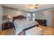 Primary bedroom with hardwood floors, neutral decor, and lots of natural light at 101 Griffin St, Stanley, NC 28164