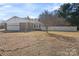 Home's exterior featuring a garage and a white picket fence at 101 Griffin St, Stanley, NC 28164