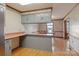 Bright kitchen features ample counter space, a stainless steel refrigerator, and light-colored cabinets at 101 Griffin St, Stanley, NC 28164