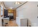 Functional laundry room with a sink, washer, dryer, storage cabinets and a chest freezer at 101 Griffin St, Stanley, NC 28164