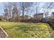 Large backyard with grassy area and benches at 10422 Ebbets Rd, Charlotte, NC 28273