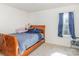 Bright bedroom with double bed and window at 10422 Ebbets Rd, Charlotte, NC 28273