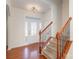 Entryway with hardwood floors, staircase, and a white door at 10422 Ebbets Rd, Charlotte, NC 28273