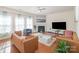 Living room with hardwood floors, fireplace, and ample natural light at 10422 Ebbets Rd, Charlotte, NC 28273