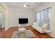 Living room with hardwood floors, white couch, and a coffee table at 10422 Ebbets Rd, Charlotte, NC 28273