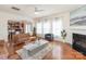 Spacious living room with hardwood floors, fireplace, and kitchen view at 10422 Ebbets Rd, Charlotte, NC 28273