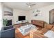 Living room with hardwood floors, fireplace, and comfortable seating at 10422 Ebbets Rd, Charlotte, NC 28273