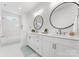 Bathroom with double vanity, white cabinets, and frameless mirrors at 114 Quail Ridge Dr, Mooresville, NC 28117