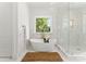 Luxurious bathroom with freestanding tub, marble tile, and large shower at 114 Quail Ridge Dr, Mooresville, NC 28117