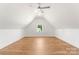 Bright attic bedroom with window and ceiling fan at 114 Quail Ridge Dr, Mooresville, NC 28117