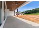 Covered patio with wood ceiling and ceiling fans, overlooking backyard at 114 Quail Ridge Dr, Mooresville, NC 28117