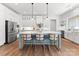 Modern kitchen with white shaker cabinets, a large island, and stainless steel appliances at 114 Quail Ridge Dr, Mooresville, NC 28117