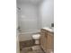 Clean bathroom with a bathtub, toilet and wood vanity at 118 Valley Springs Dr, Olin, NC 28660