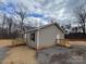 Tan house with gray roof and black shutters, side view at 118 Valley Springs Dr, Olin, NC 28660