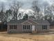 Tan house with gray roof, wood stairs, and black shutters at 118 Valley Springs Dr, Olin, NC 28660