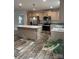 Modern kitchen with an island, stainless steel appliances, and light wood cabinets at 118 Valley Springs Dr, Olin, NC 28660