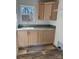 Laundry room with light wood cabinets and a green tile backsplash at 118 Valley Springs Dr, Olin, NC 28660