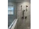 Walk-in shower with marble tile and modern fixtures at 118 Valley Springs Dr, Olin, NC 28660