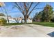 Large backyard featuring a concrete patio and white fence, perfect for outdoor activities and privacy at 11828 Mirror Lake Dr, Charlotte, NC 28226