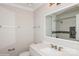 Bright bathroom with a white vanity, modern fixtures, and a clear view of the tiled shower at 11828 Mirror Lake Dr, Charlotte, NC 28226