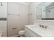 Bathroom vanity with quartz counters and updated shower with decorative tile at 11828 Mirror Lake Dr, Charlotte, NC 28226