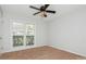 Bedroom with natural light from large windows, offering a bright and inviting space for relaxation at 11828 Mirror Lake Dr, Charlotte, NC 28226