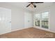 This bedroom features neutral walls, carpet, and natural light offering a blank canvas to personalize at 11828 Mirror Lake Dr, Charlotte, NC 28226