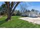 Garage and backyard with a tree in the front at 11828 Mirror Lake Dr, Charlotte, NC 28226