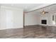 Living room shows the fireplace, ceiling fan, and access to other areas of the house at 11828 Mirror Lake Dr, Charlotte, NC 28226