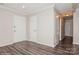 A spacious, neutrally painted living room with clean trim and laminate floors at 11828 Mirror Lake Dr, Charlotte, NC 28226