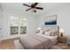 The main bedroom boasts a plush bed, stylish nightstands, and an artful accent wall for a serene retreat at 11828 Mirror Lake Dr, Charlotte, NC 28226