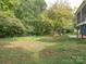 Spacious backyard with shed and wooded area at 1204 Allenbrook Dr, Charlotte, NC 28208